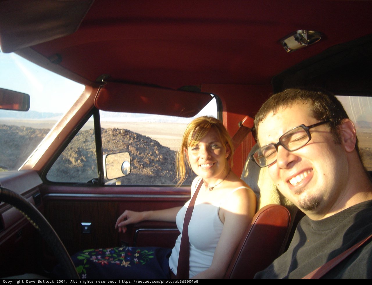 Two Friends Road Tripping Through Desert Landscape