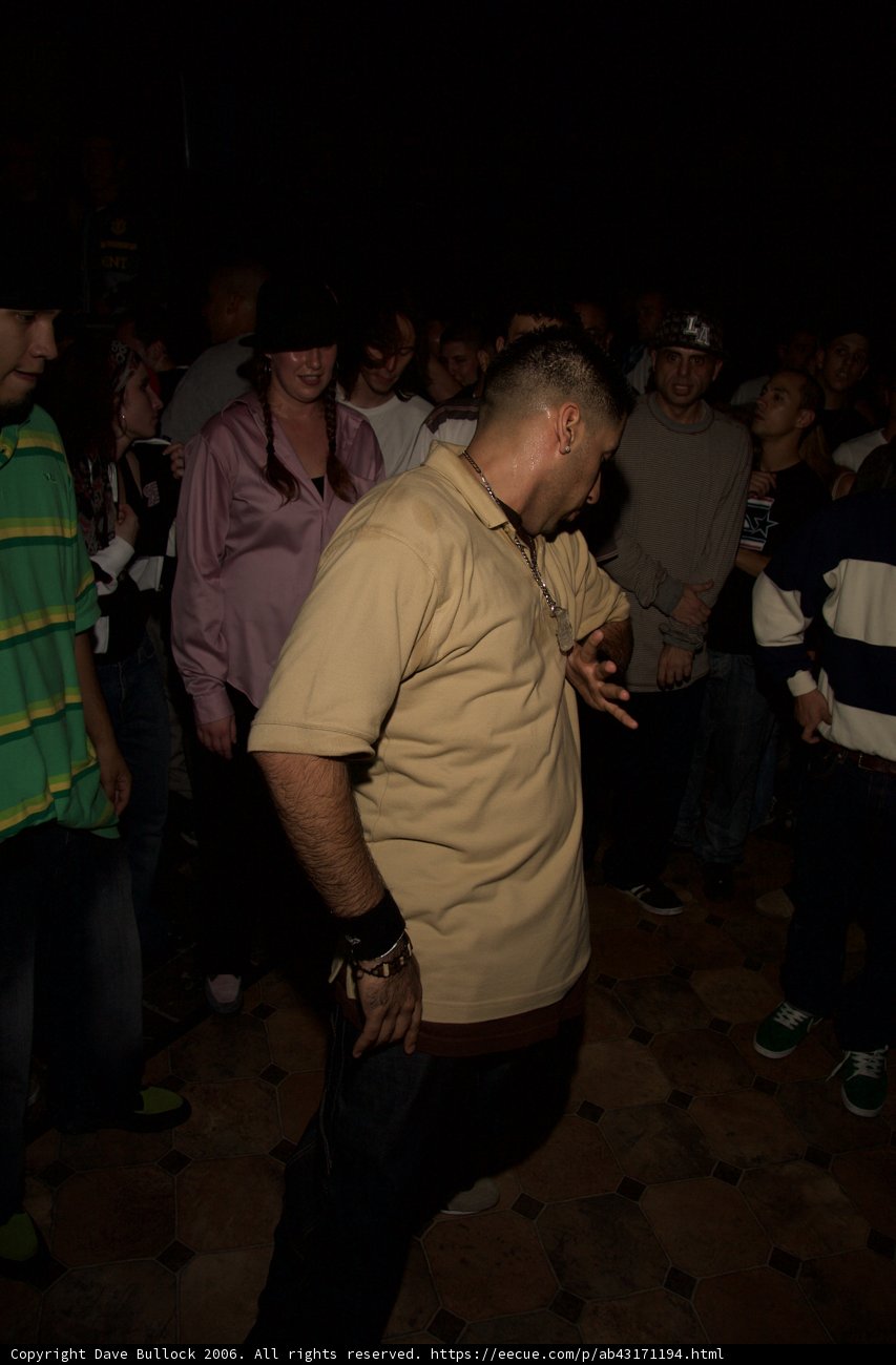 Man in Tan Shirt in the Crowd