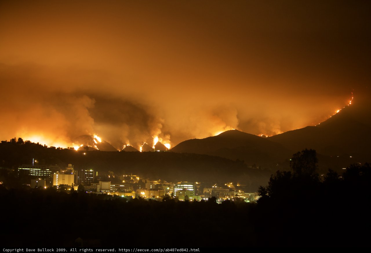 Blaze Ravages Mountains & Cityscape
