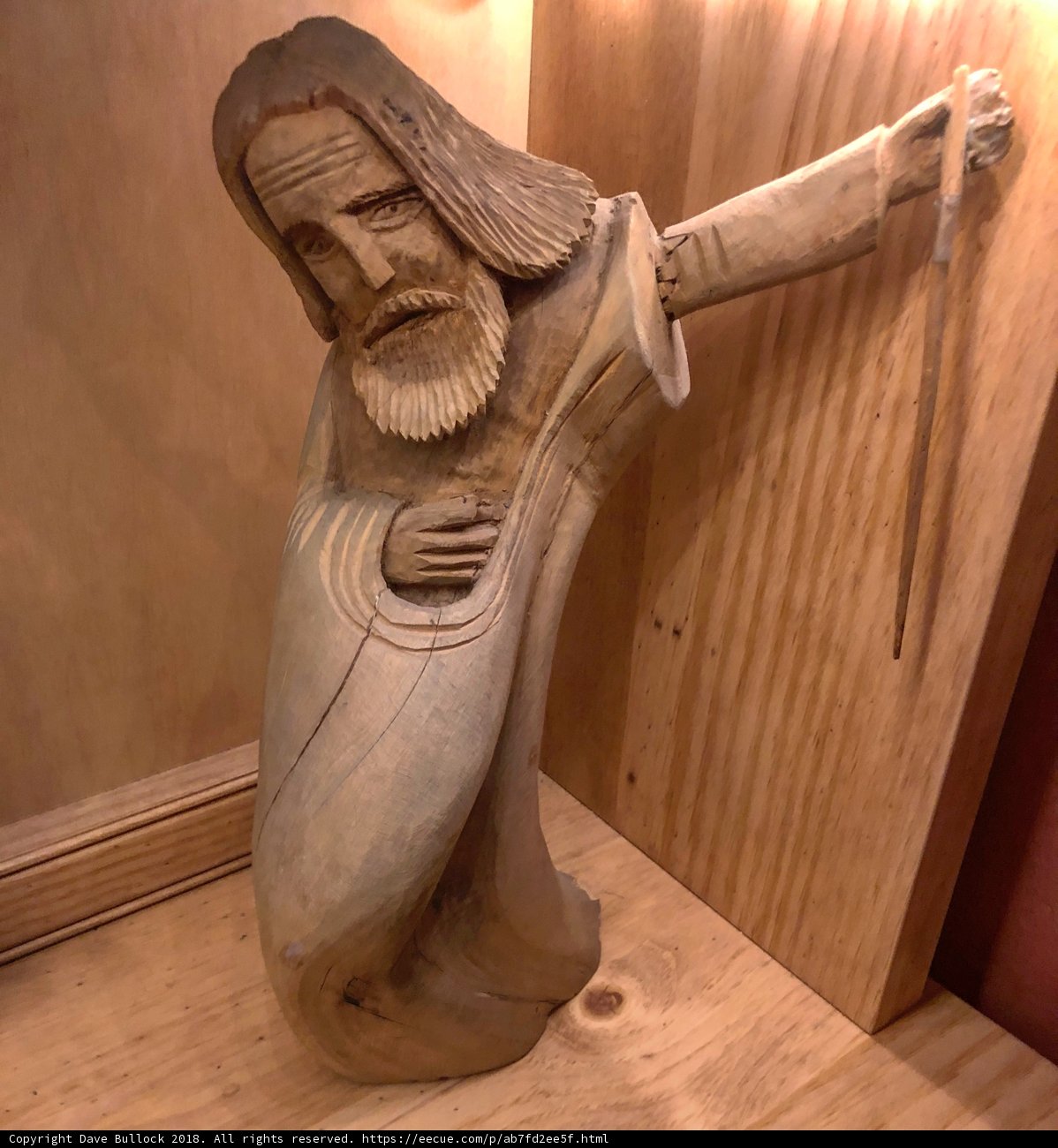 Wooden Statue of a Knife-Wielding Man