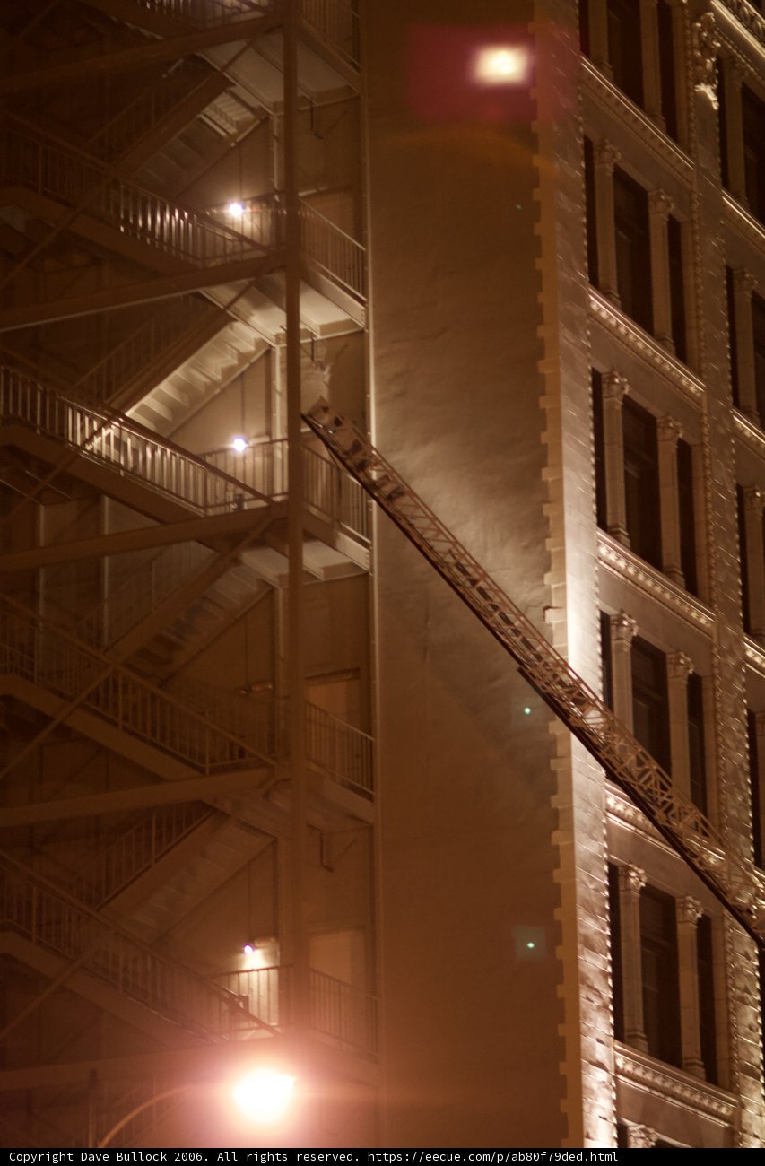 Nighttime Firefighting on Building Roof