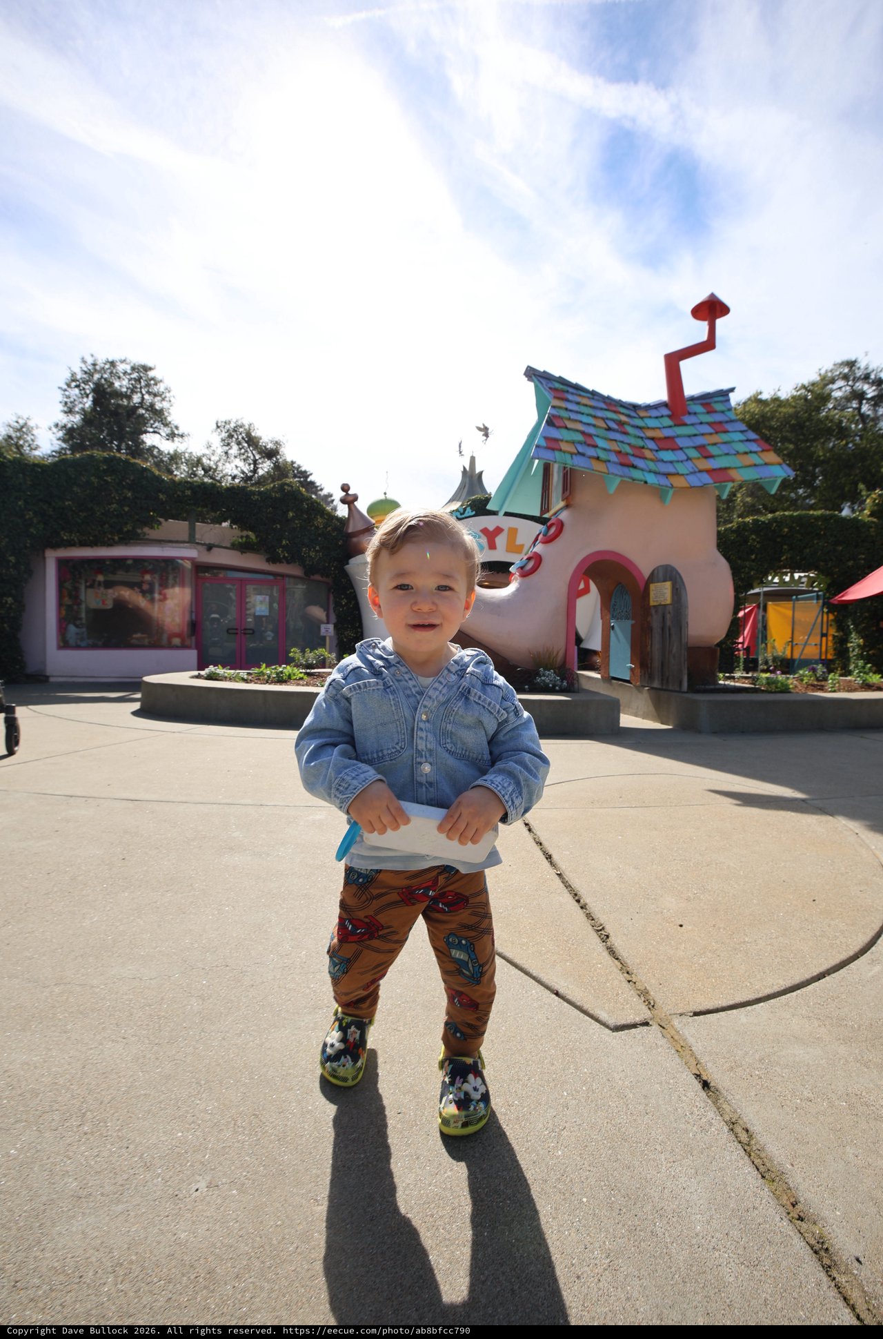 Joyful Toddler at Whimsical Shoe House Attraction