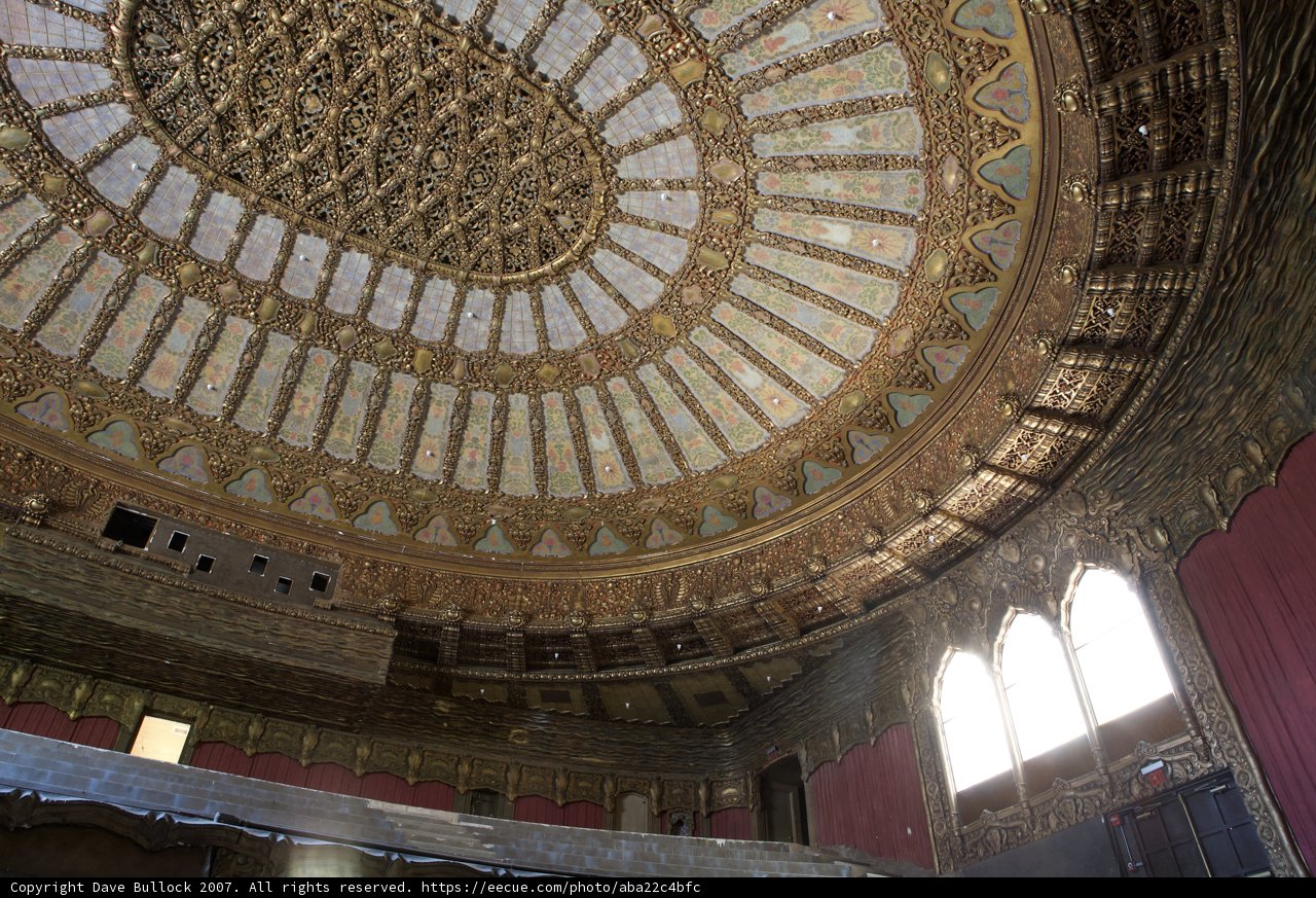 Ornate Gold and Red Ceiling of a Religious Building