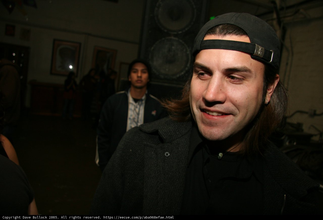 The Smiling Man in the Hat