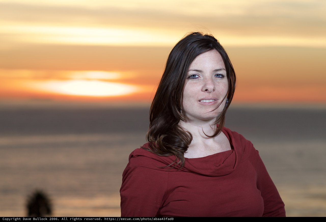 Woman in Red at Golden Hour Seaside Sunset