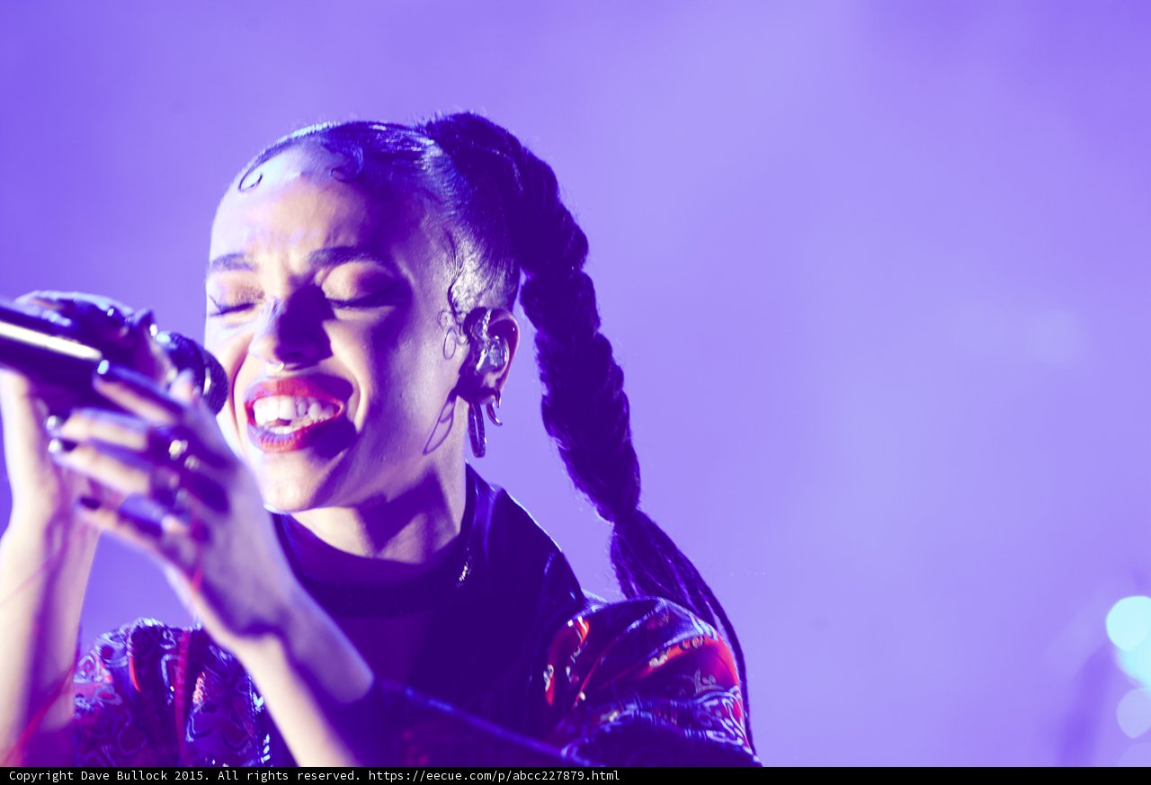 FKA twigs Incredible Close-Up Portrait Eyes Closed Mouth Open Powerful Vocal Baby Hairs Swirls Hoop Earrings Red Lipstick Braided Ponytails Black Choker Rings Kimono Purple Blue Lighting Spotlight