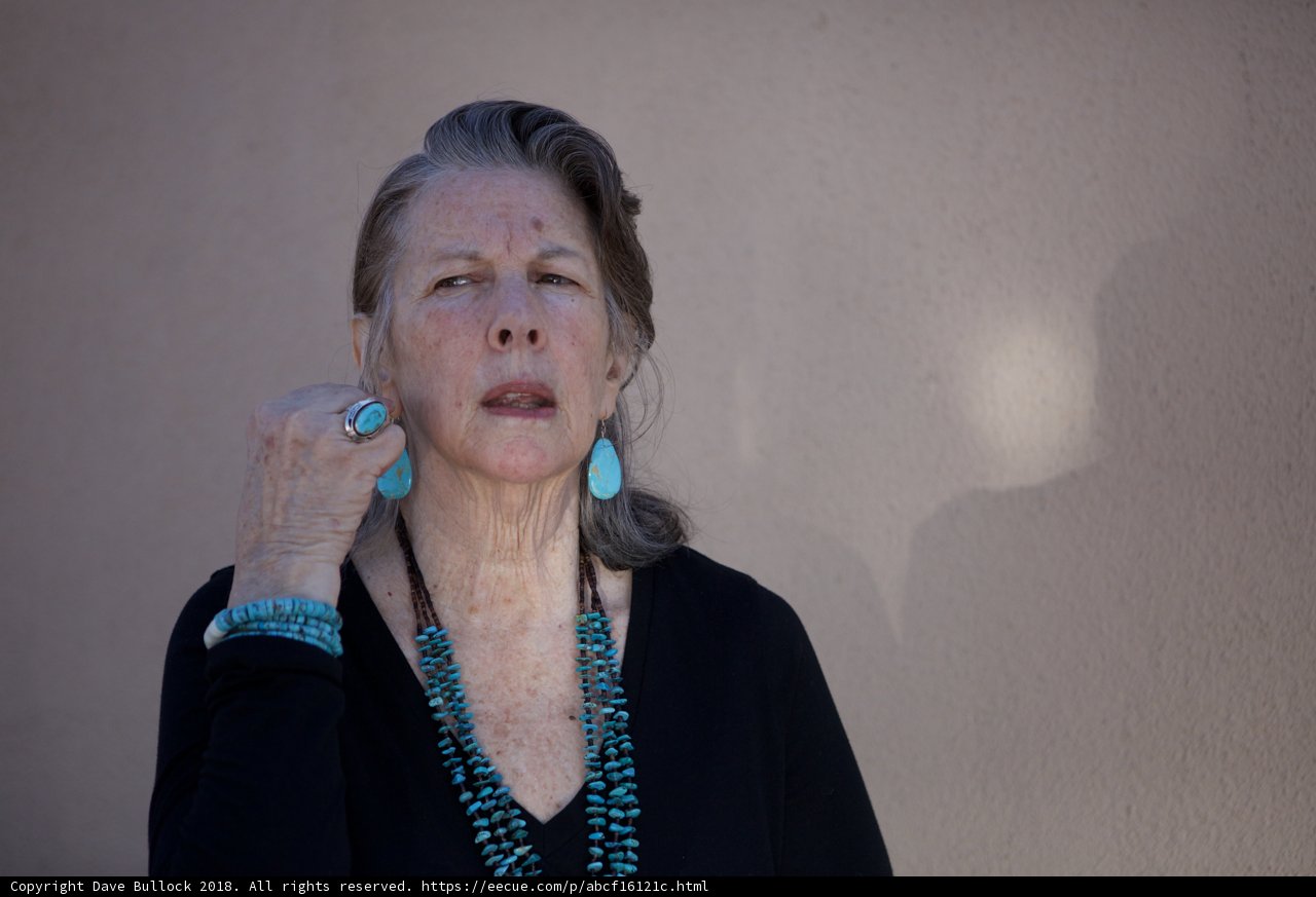 Turquoise treasures Caption: Rhoda B's hand adorned with a beautiful turquoise necklace and rings, a true statement piece.