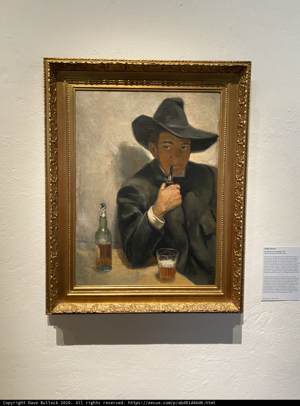 Man in Hat Smoking a Cigarette