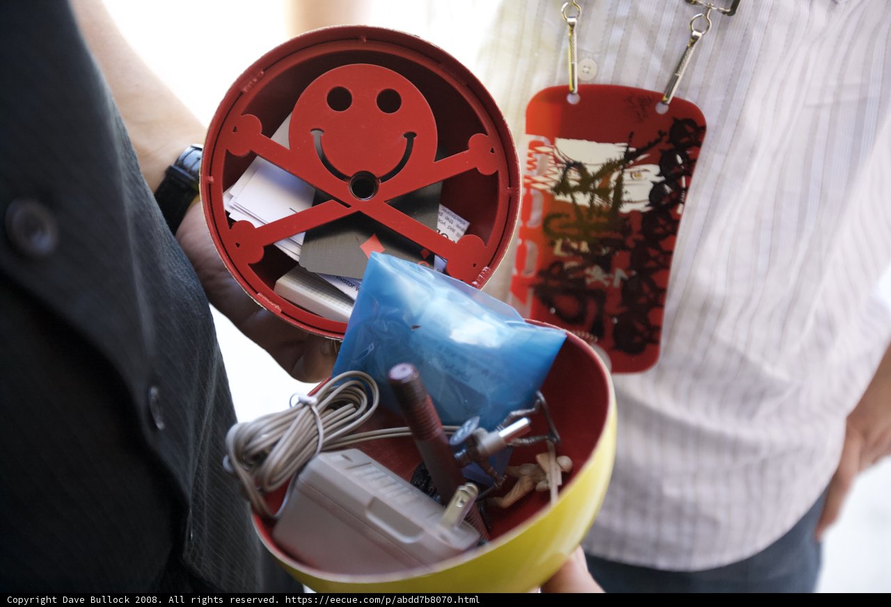 Smiling Man with Red Tin