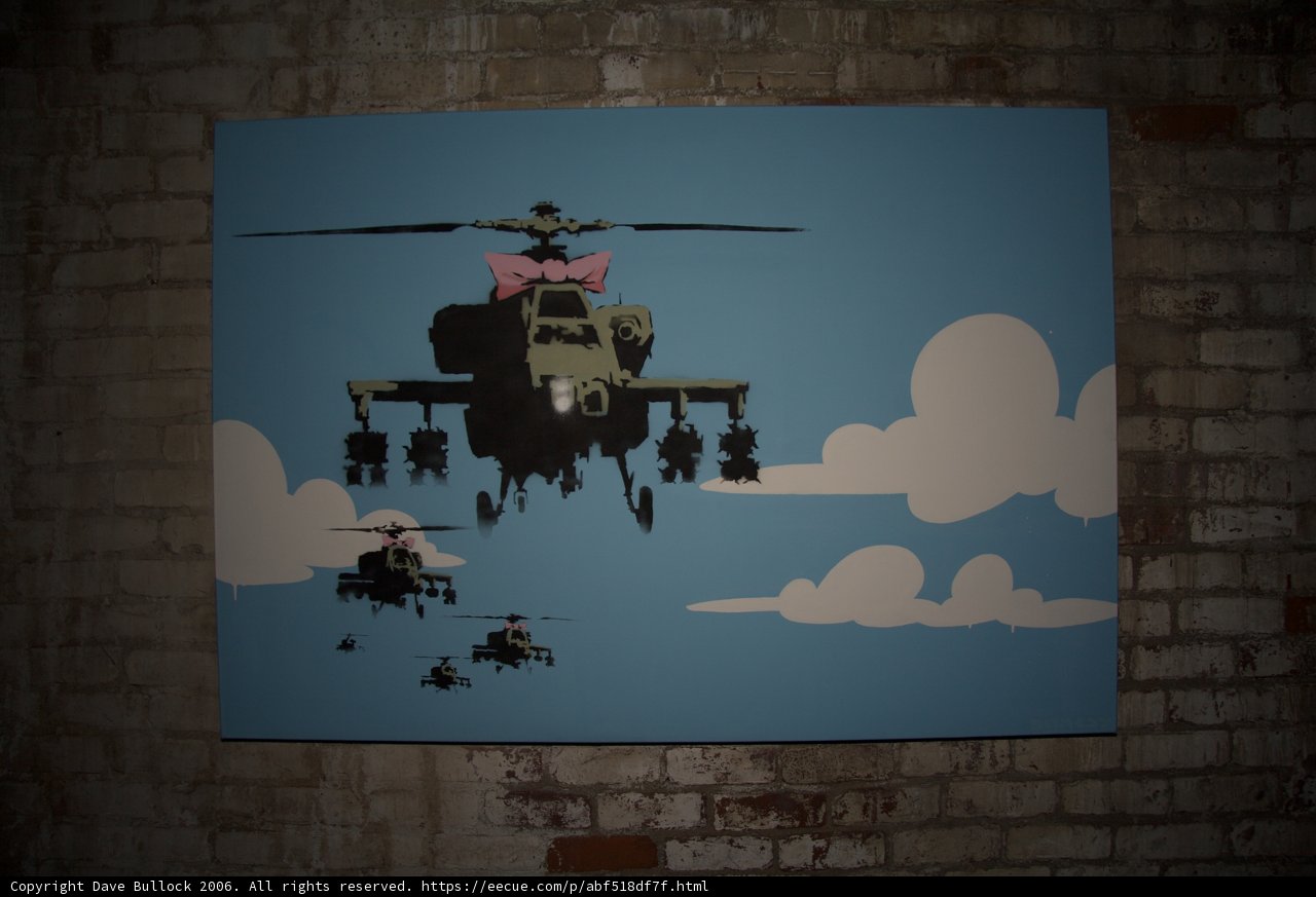 Helicopter Flying over Brick Wall