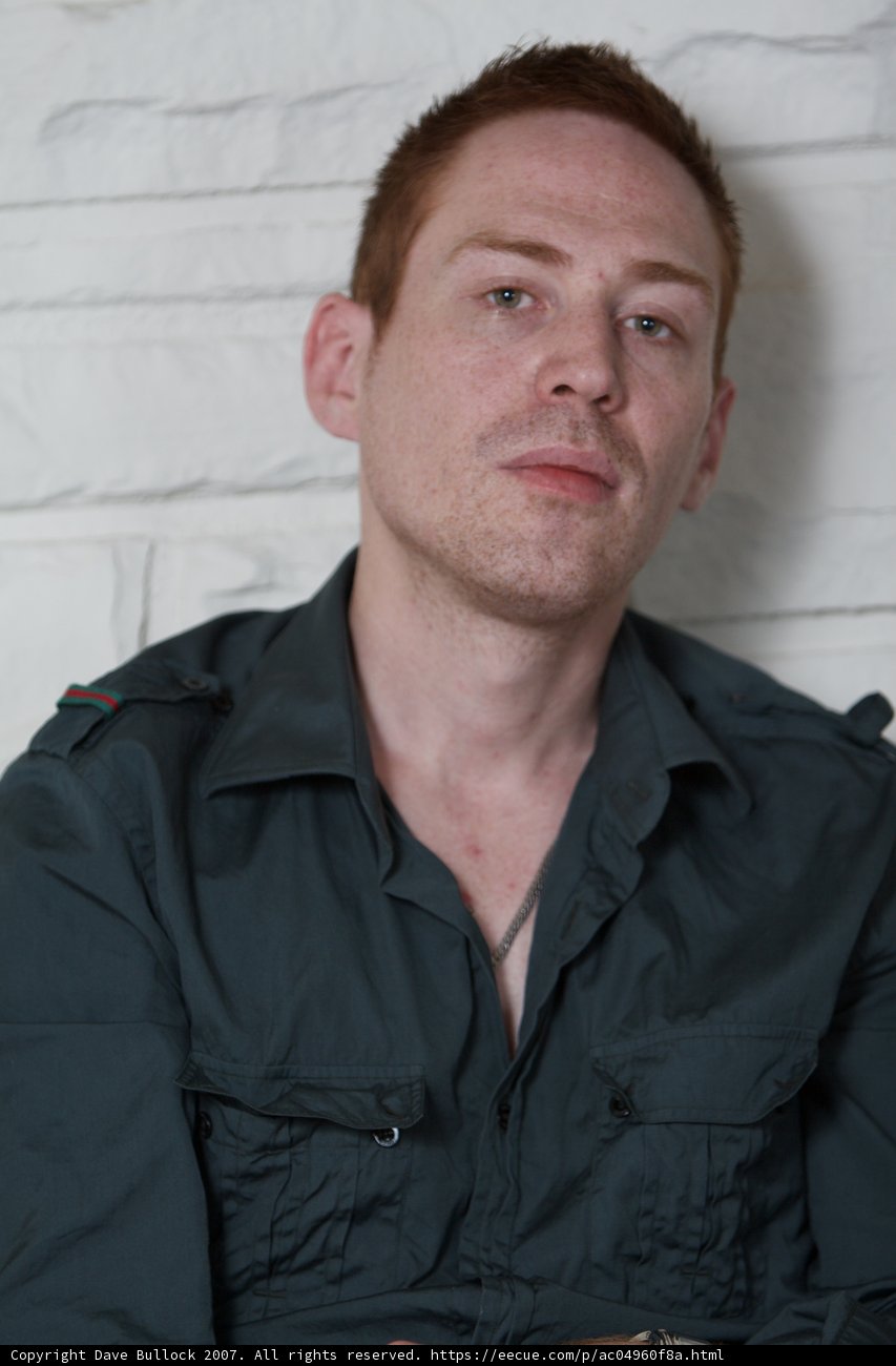 A Portrait of a Man in a Green Shirt