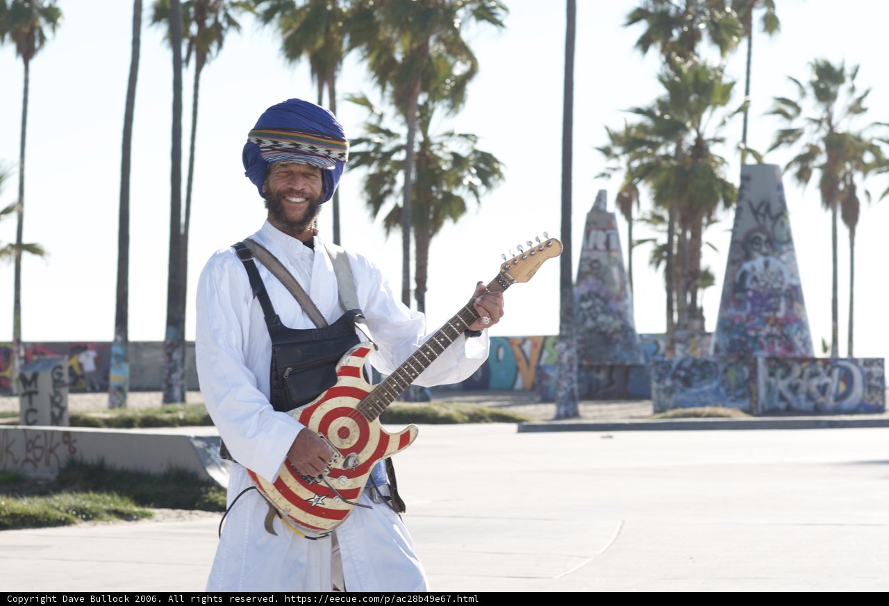 Turbaned Guitarist Shreds by the Palm Trees