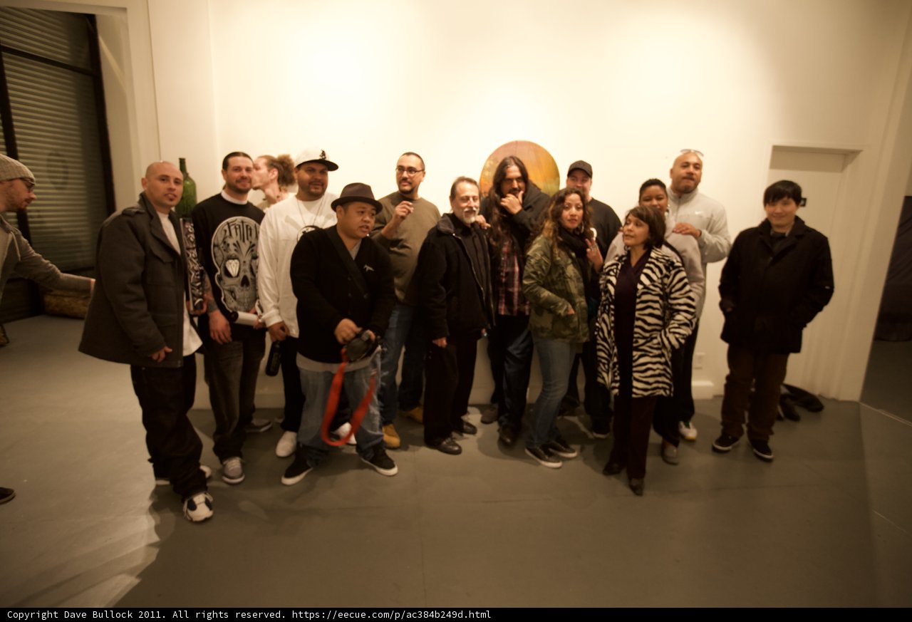 Group of People Enjoying Art at Plata Wine Party