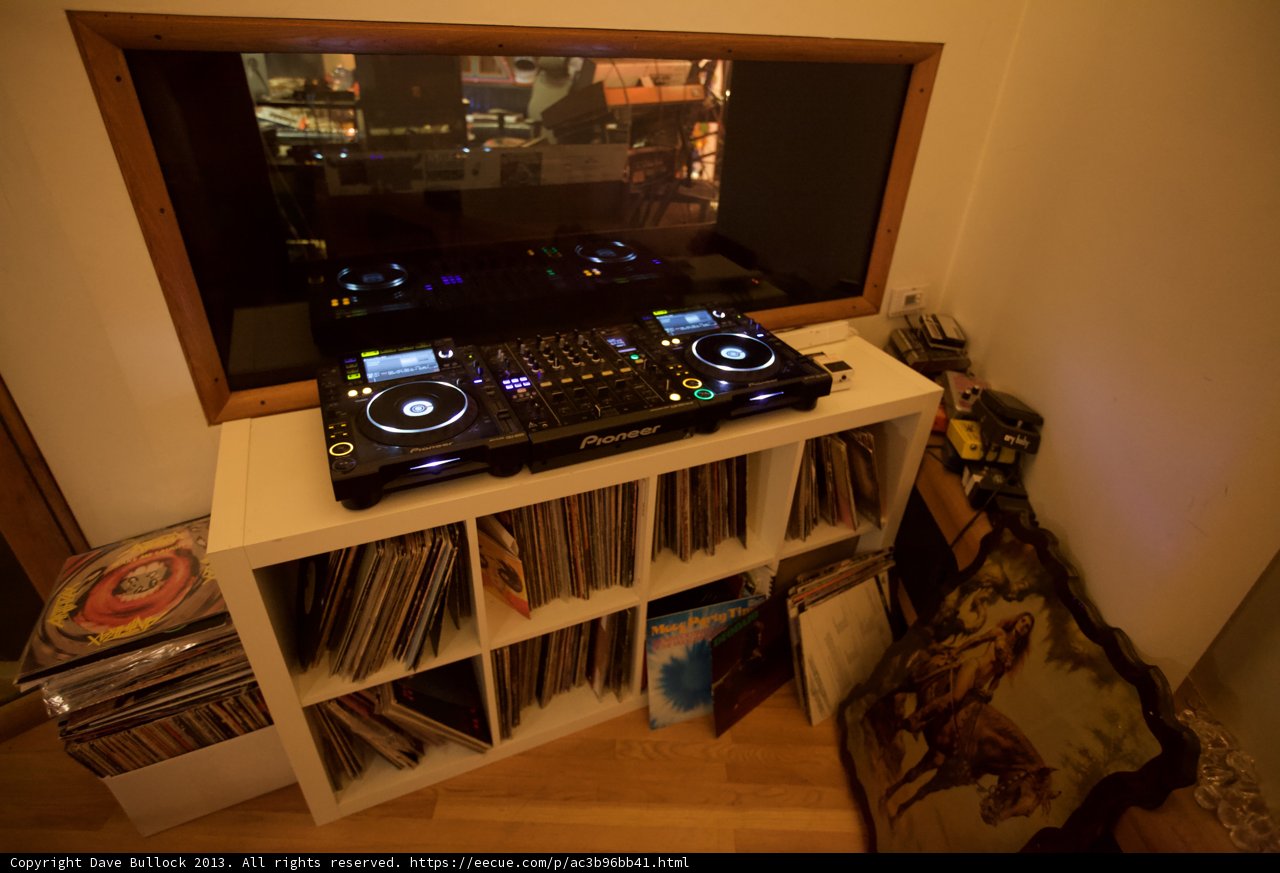 DJ Mixer and CD Player on Wooden Shelf