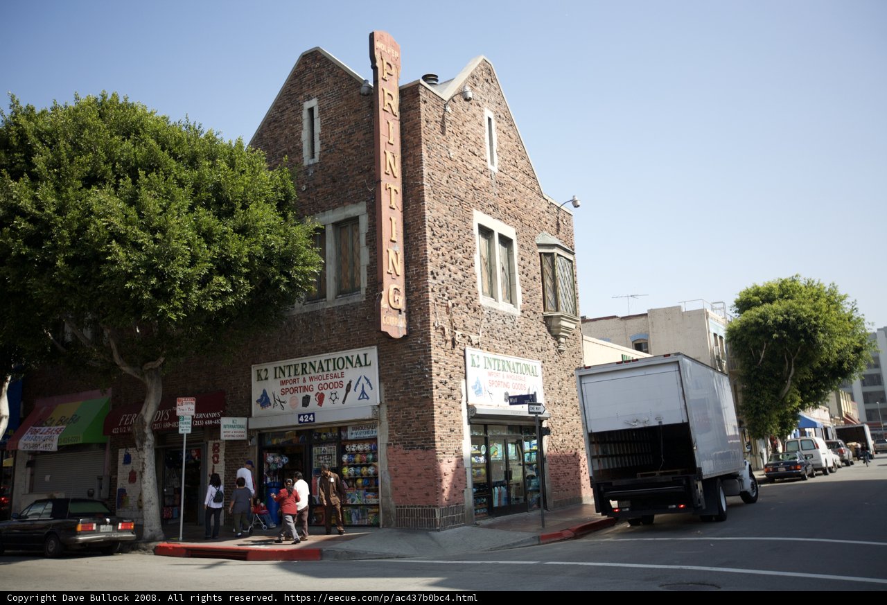 Truck Parked in Front of Brick Building