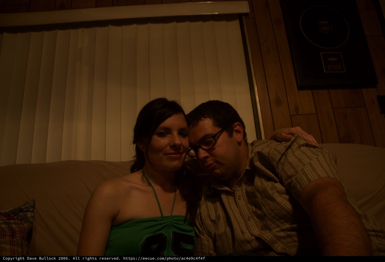 Couple Relaxing Together on Couch at Night
