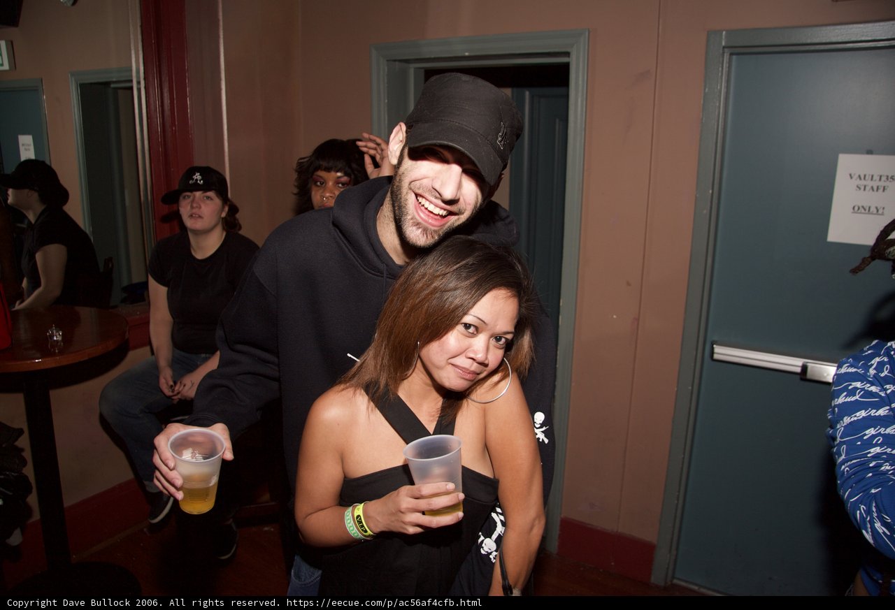 Partygoers Enjoying Drinks at an Urban Pub