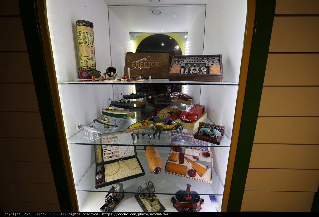 Vintage Toy Collection Display in Illuminated Cabinet