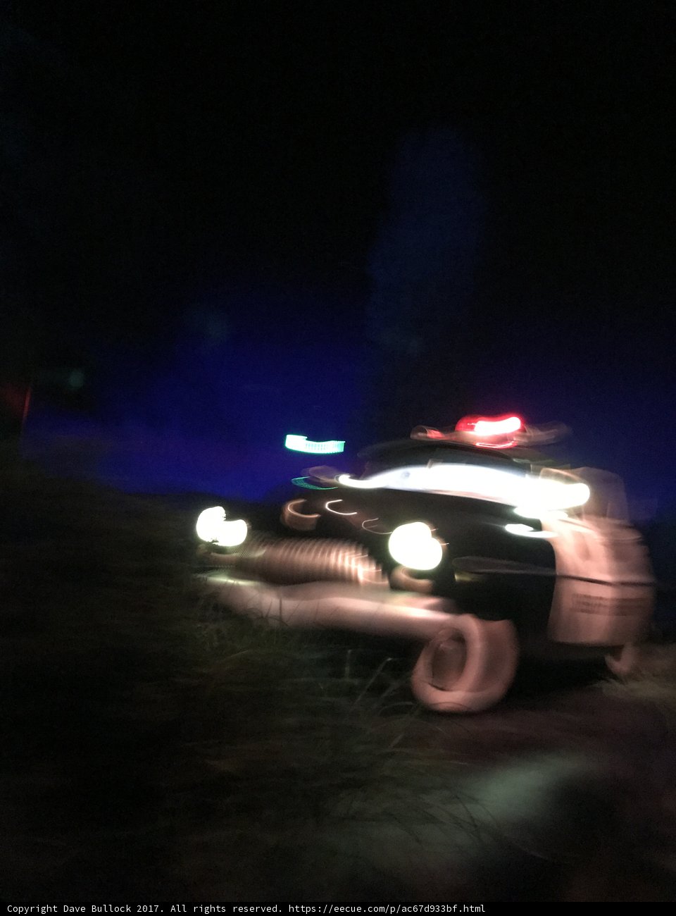Blurred Police Car Patrols at the Park at Night