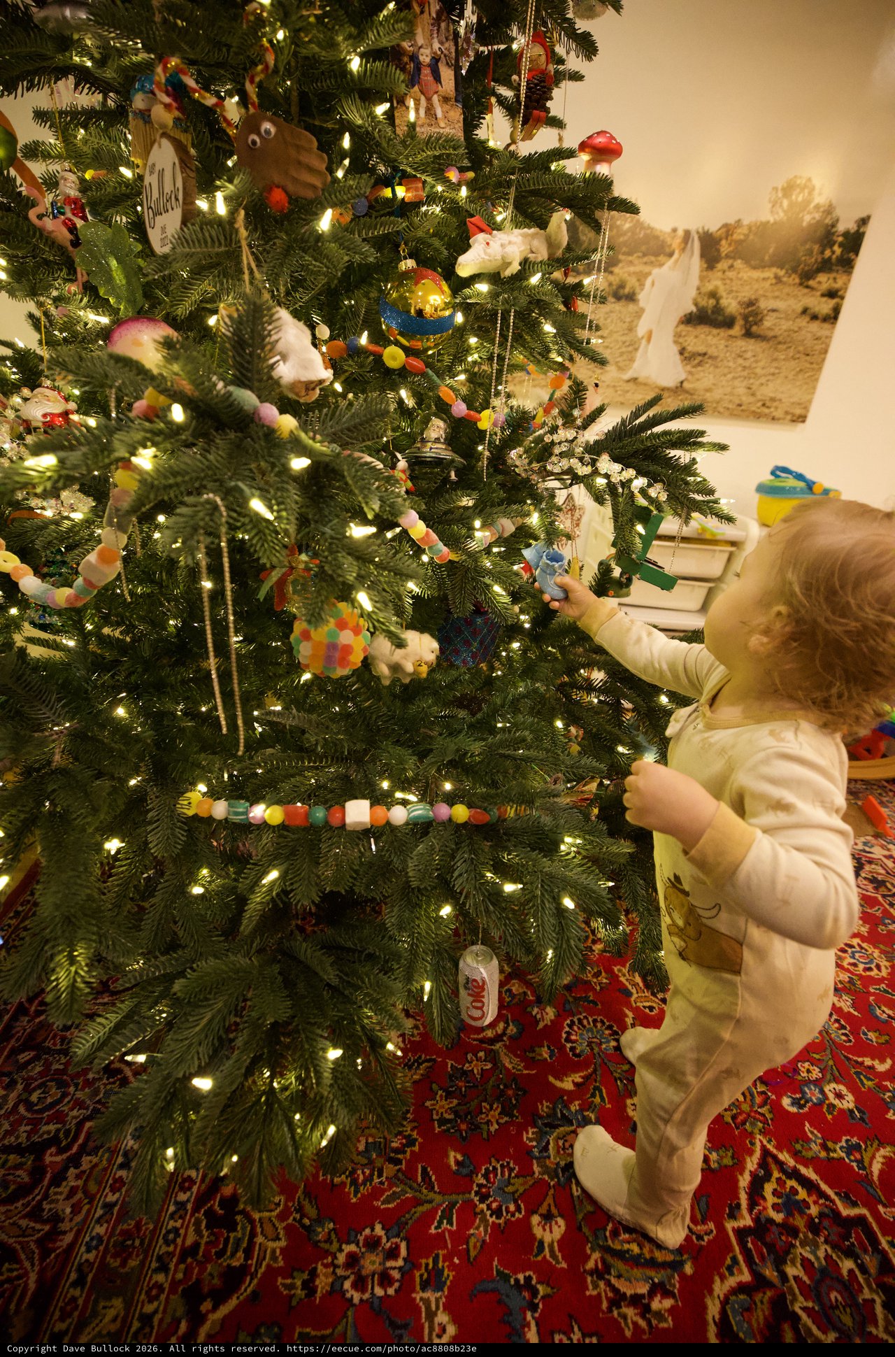 Toddler Decorating Christmas Tree with Handmade Ornaments