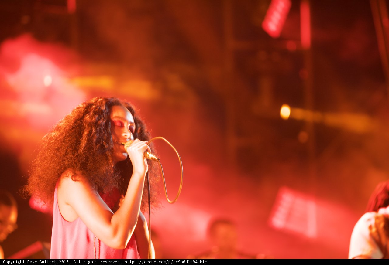 Solange Portrait Singing Band Spotlight Red Orange