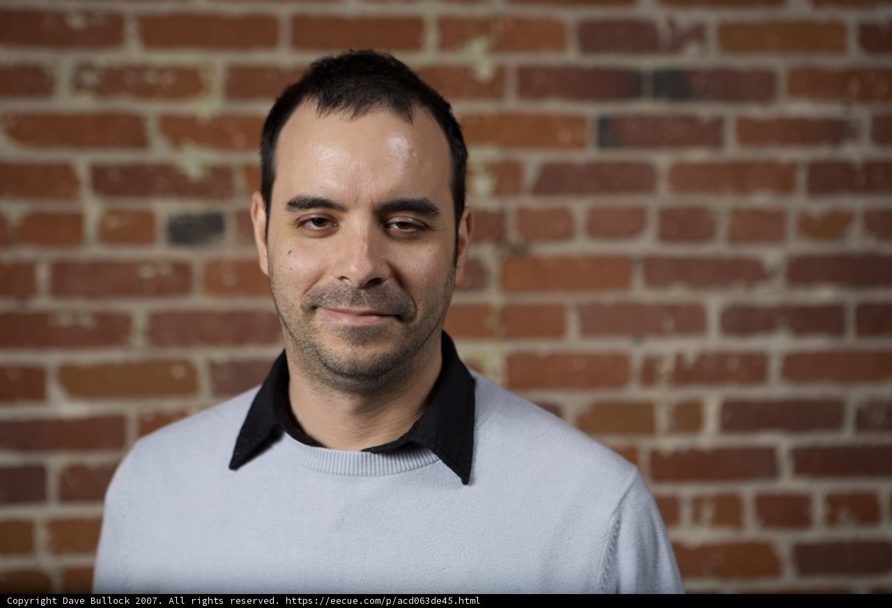 The Happy Man against the Brick Wall