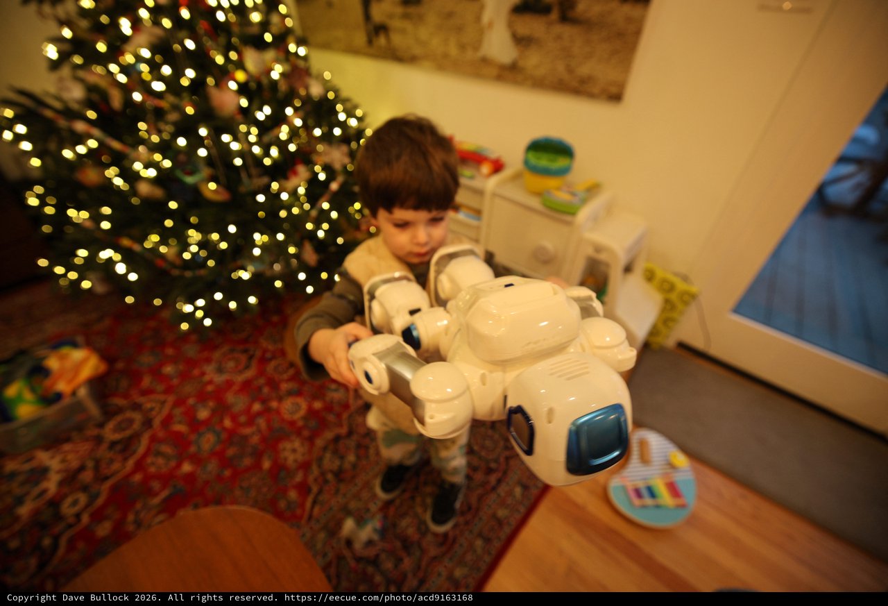 Child Playing with Robot Toy on Christmas Morning