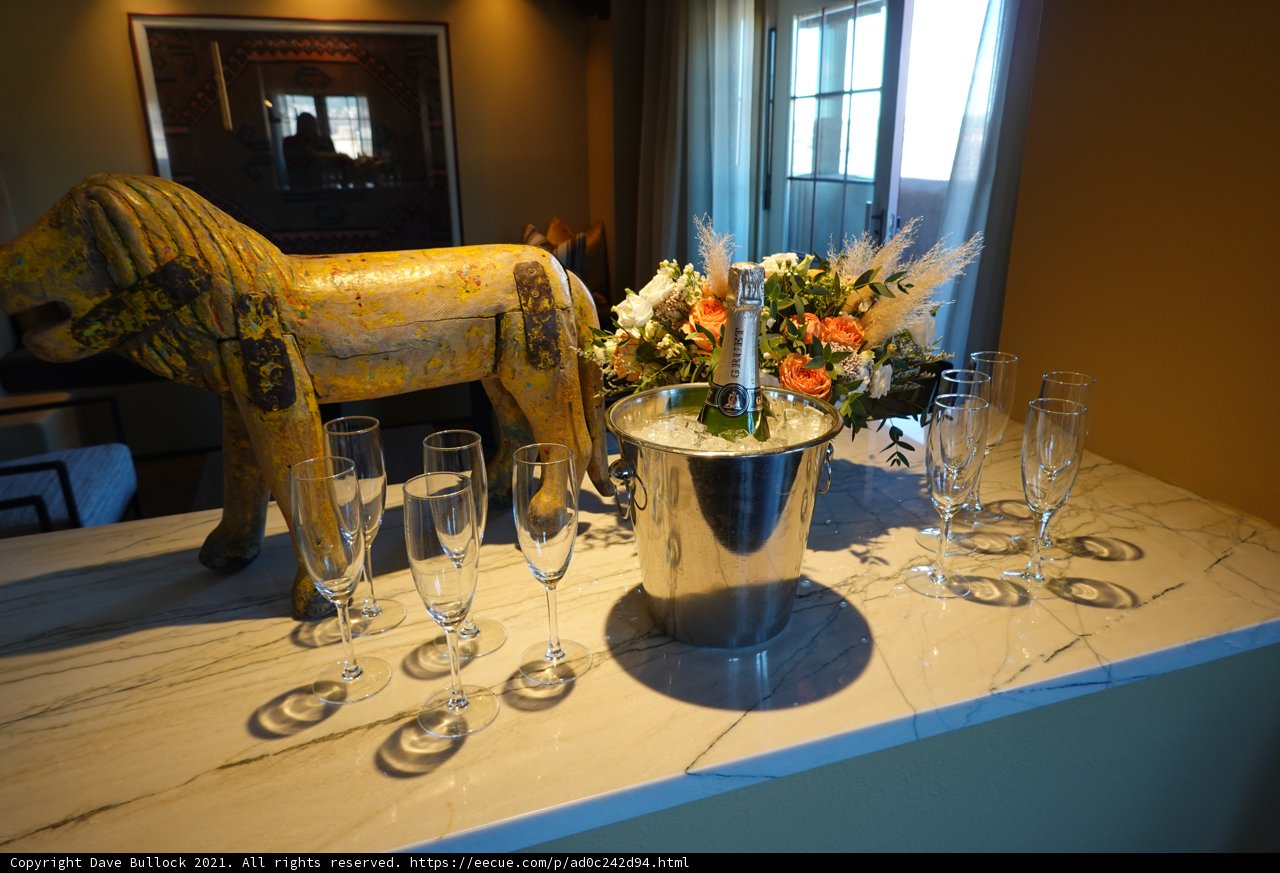 Lion Statue and Glasses on a Wooden Table
