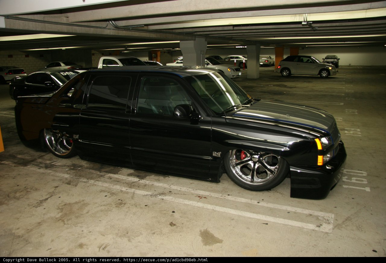 Alloy Wheels on a Black Truck in a Parking Garage