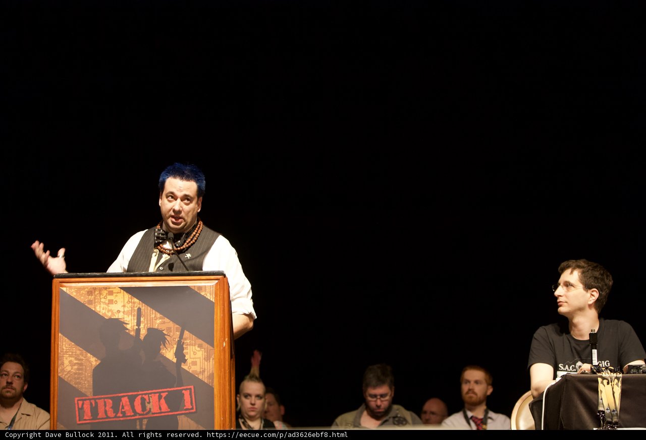 Blue-Haired Speaker at Defcon Podium