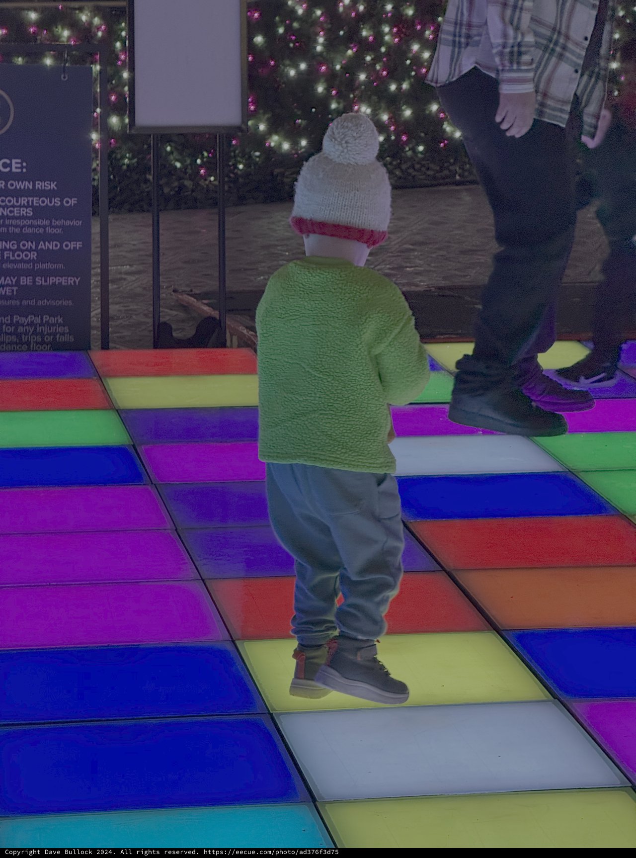 Child Dancing on Colorful LED Floor