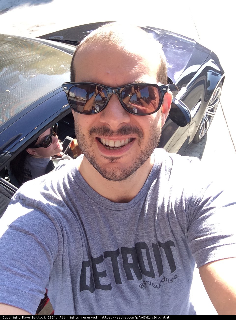 Selfie in Shades with a Stylish Sedan