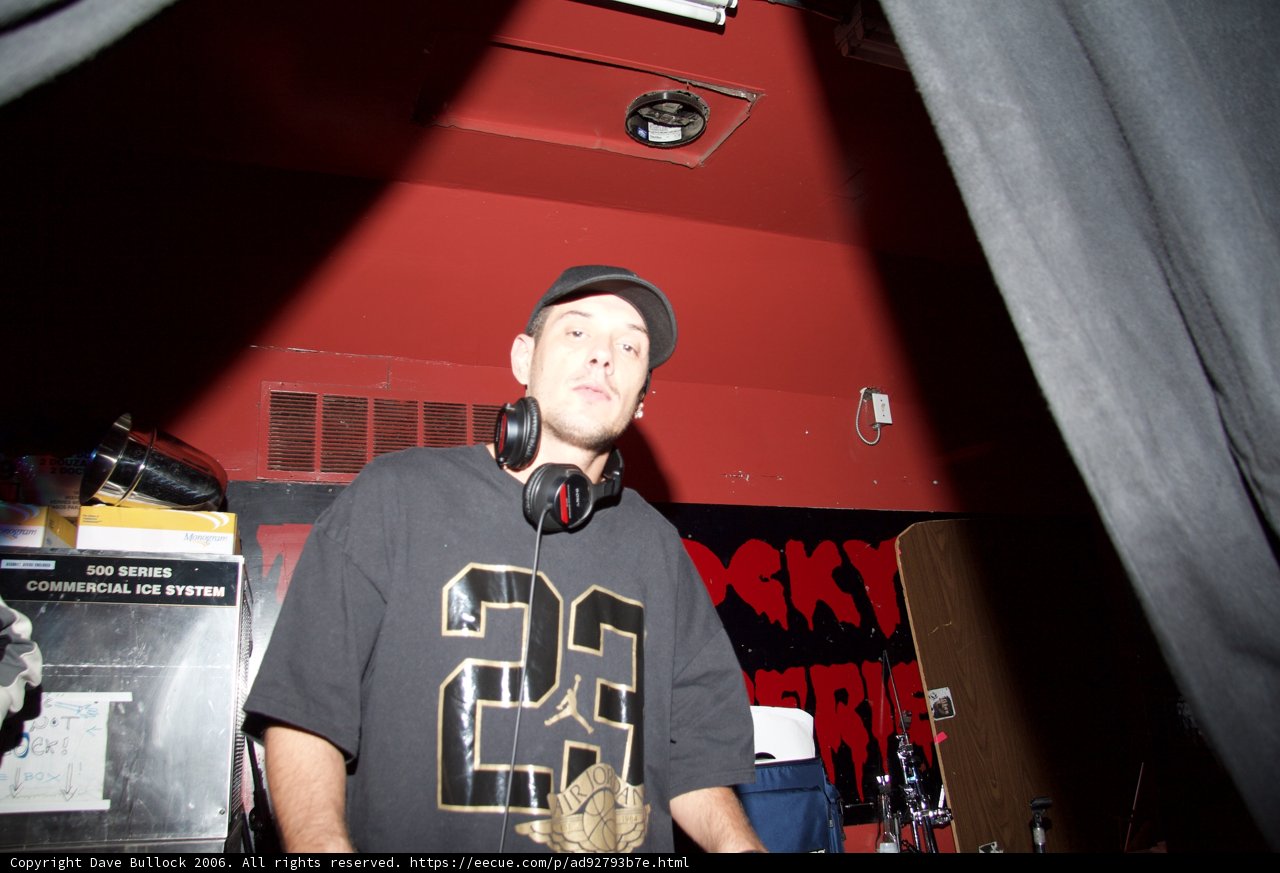 DJ S rocking the black tee and baseball cap