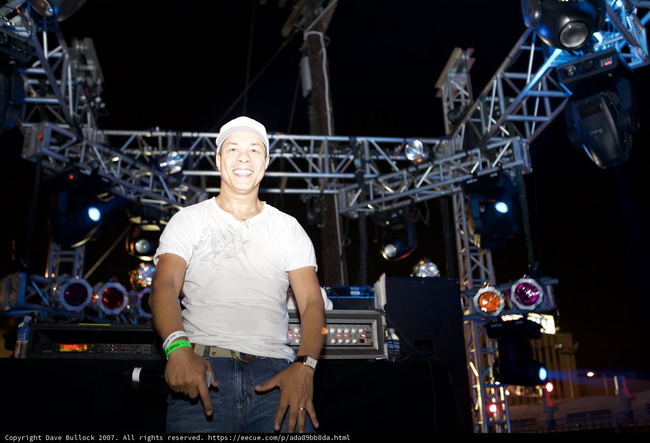 Man in White Shirt Stands Center Stage