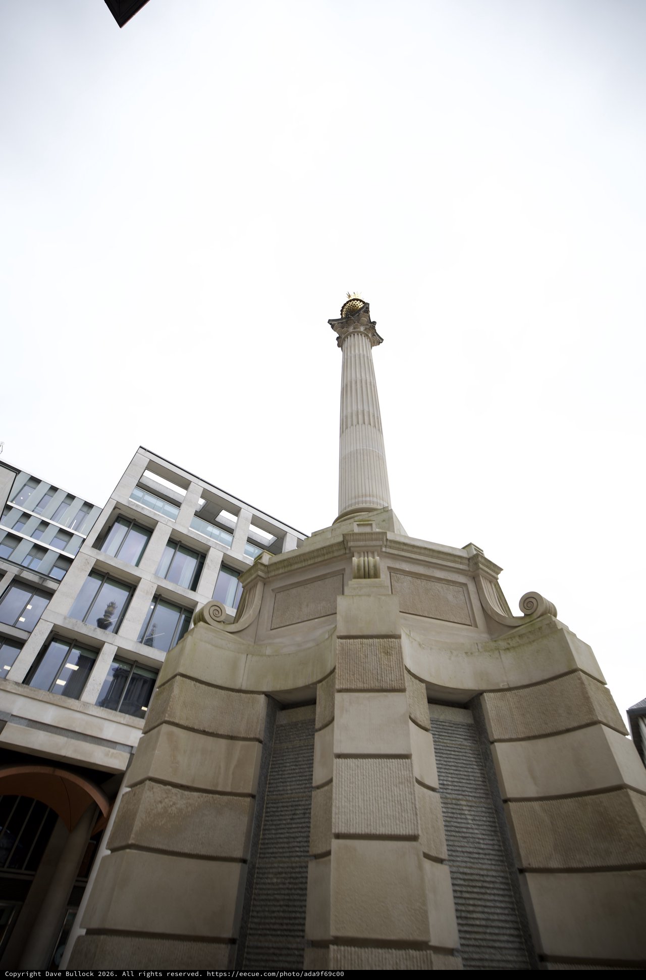 Classical Stone Column Monument in Urban London Setting