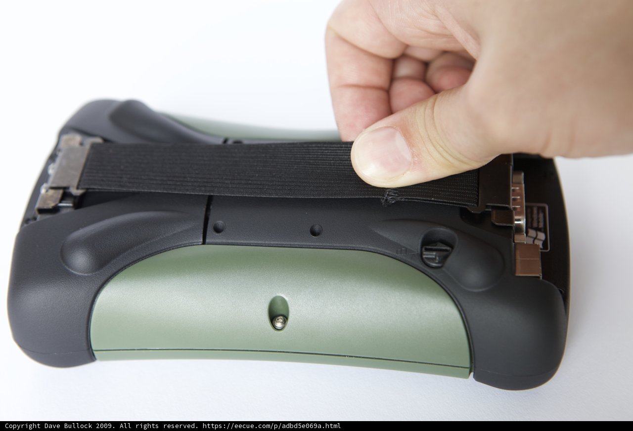 Hand holding electronic pistol strap