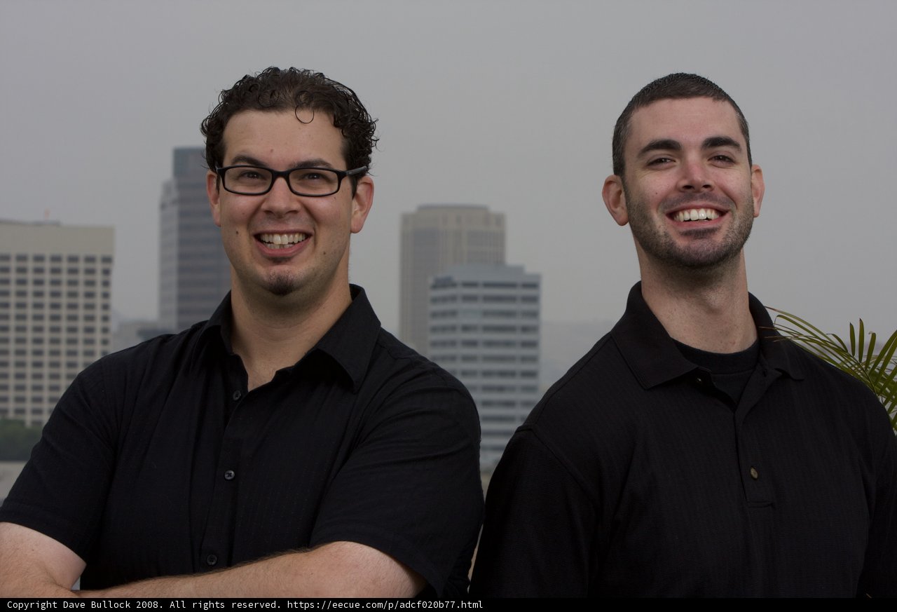 Two Happy Men in Black with Eyeglasses