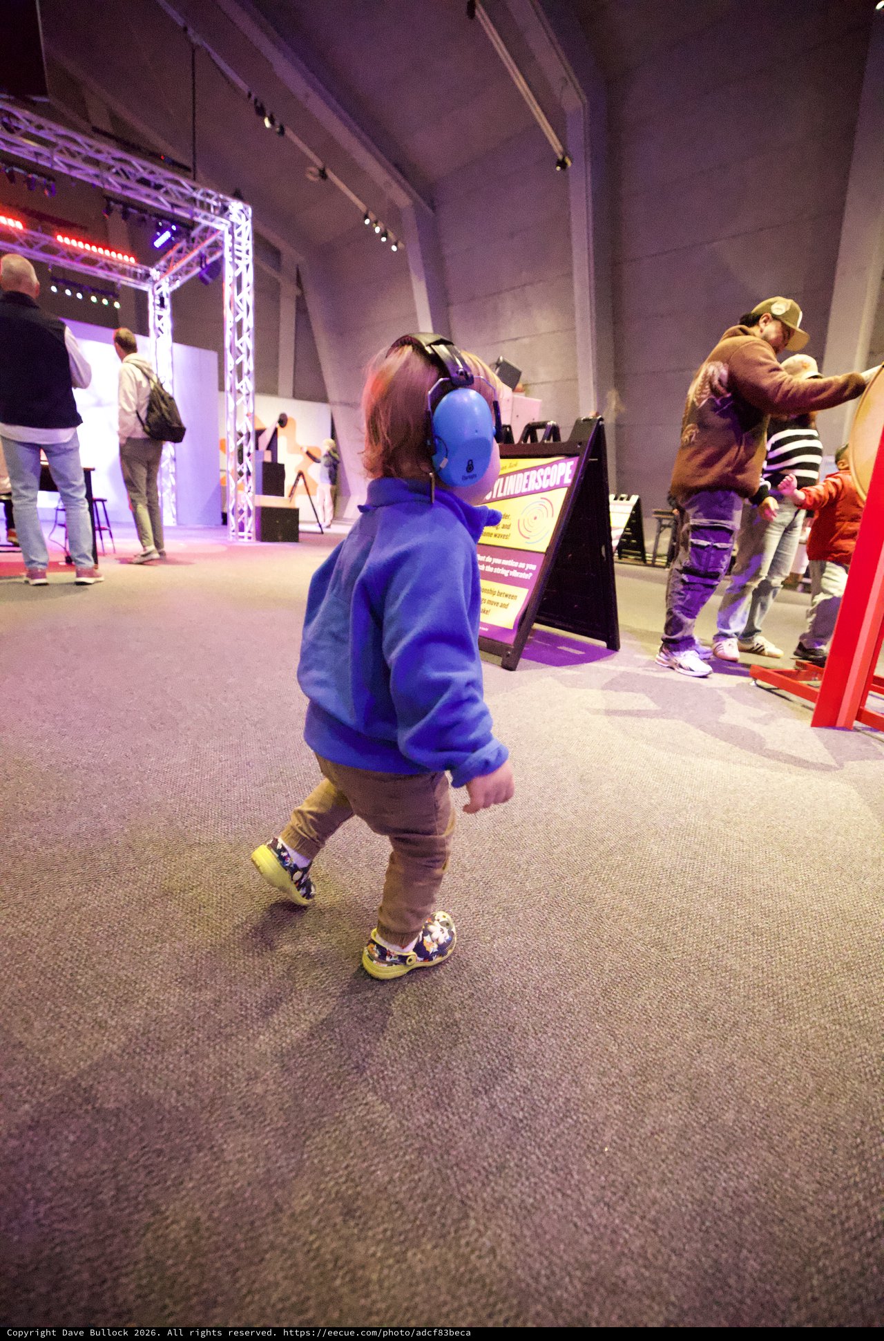 Child with Headphones at Interactive Museum Exhibit