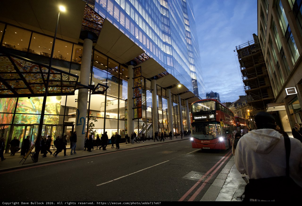 Modern London Architecture at Twilight with Red Bus