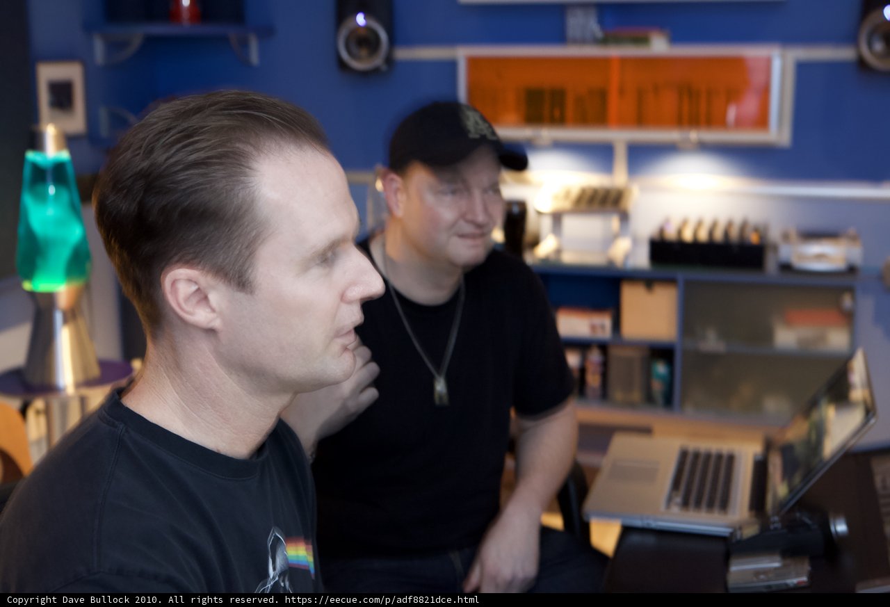 Two Men Working on Computers in a Cozy Room