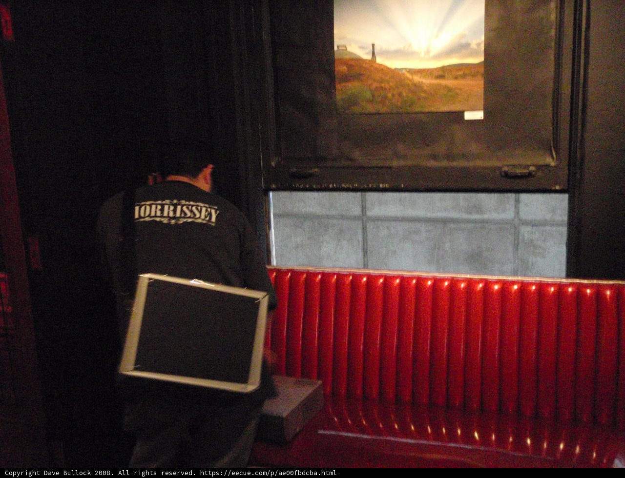 Man Contemplates Digital Display