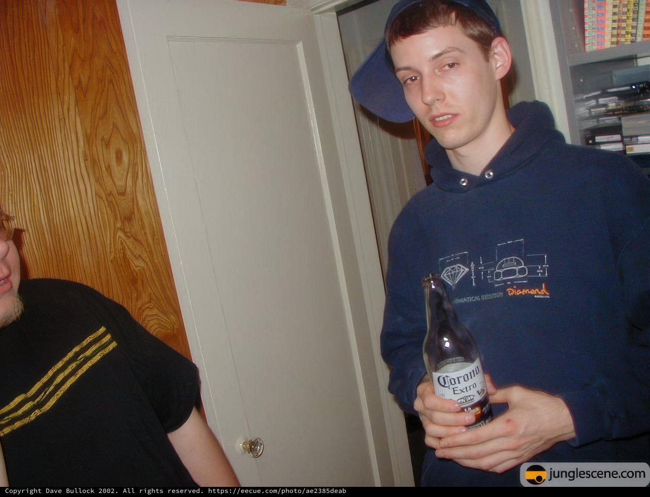 Blue Hoodie and a Bottle of Beer