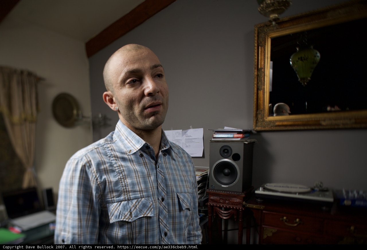 Reflections of a Blue-Shirted Man