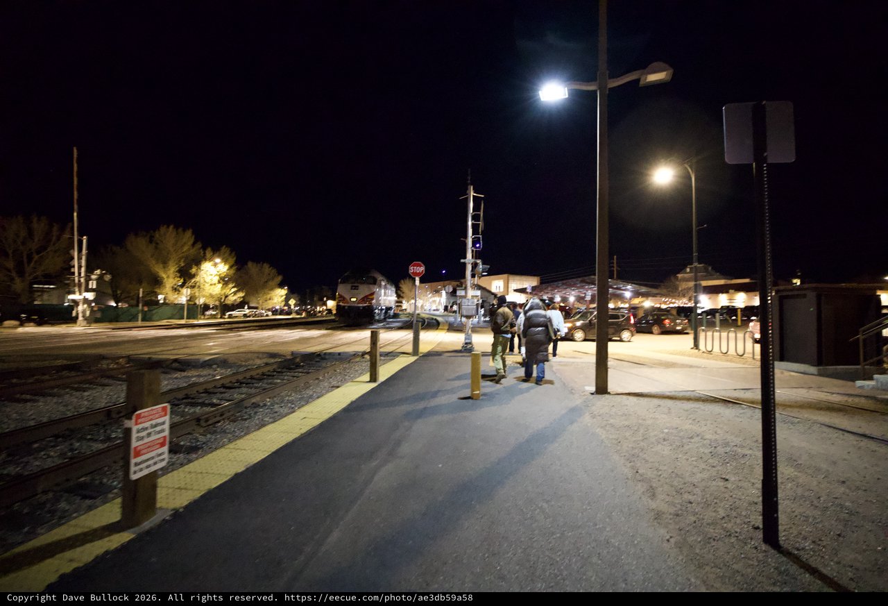 Night Arrival at Illuminated Train Station Platform