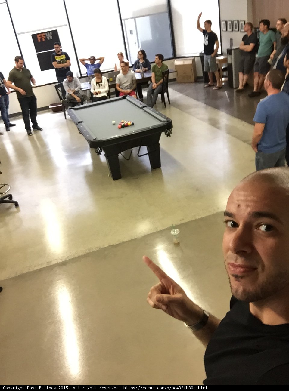 FFW Office All Hands Meeting Selfie Pointing Pool Table Employees Gathered Tech Startup Interior Clear Shot