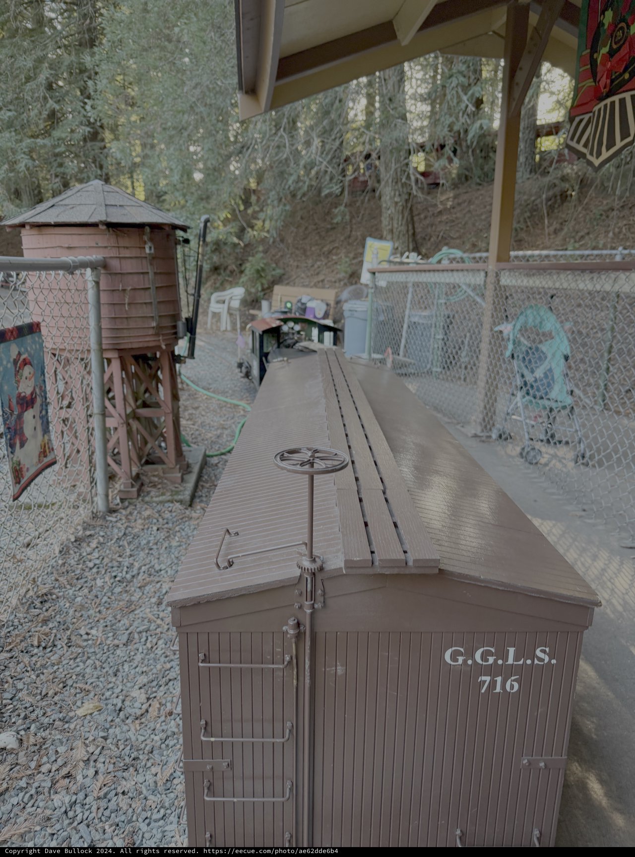 Vintage Model Railroad Car in Garden Setting