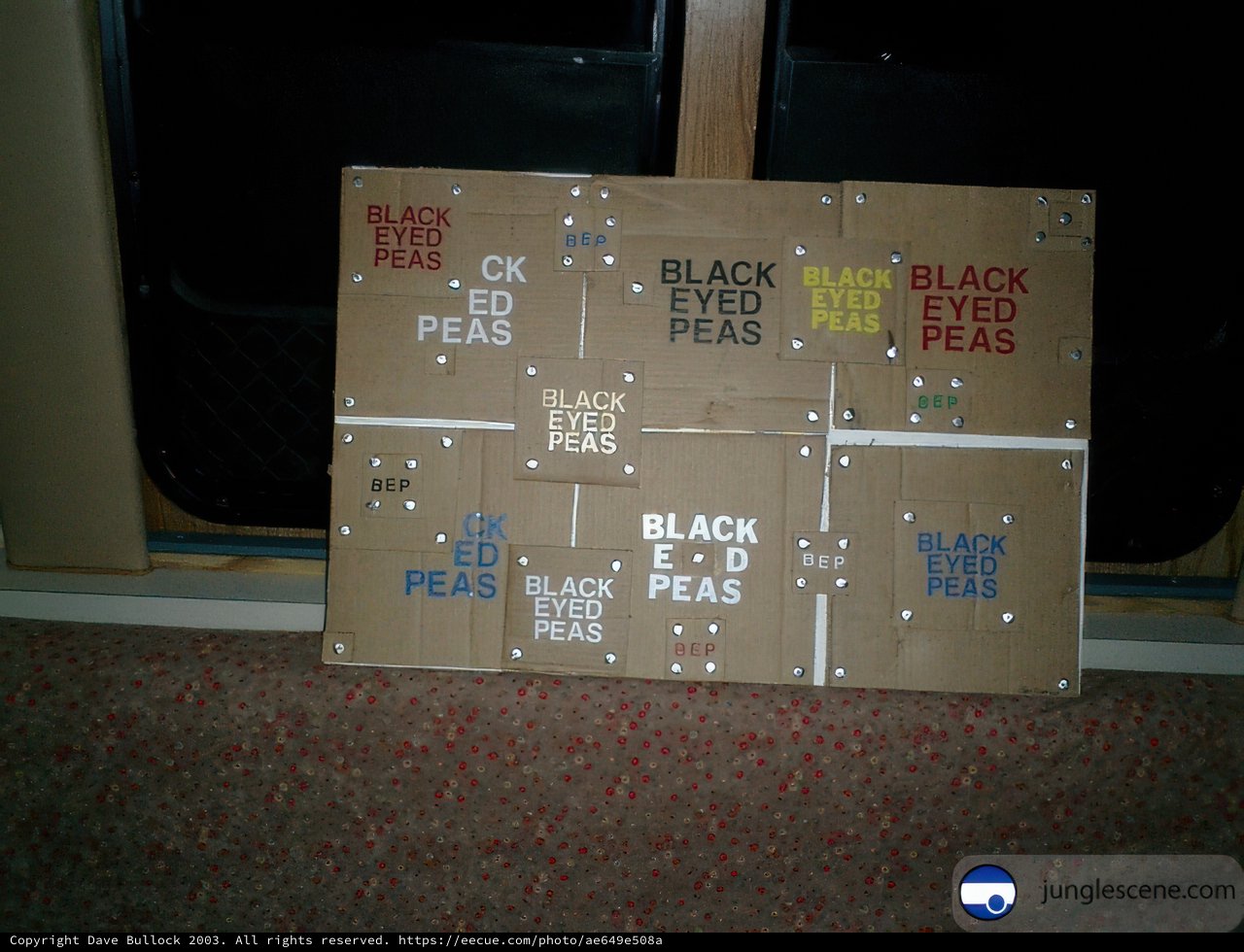 Black "Pees" on Cardboard Sign