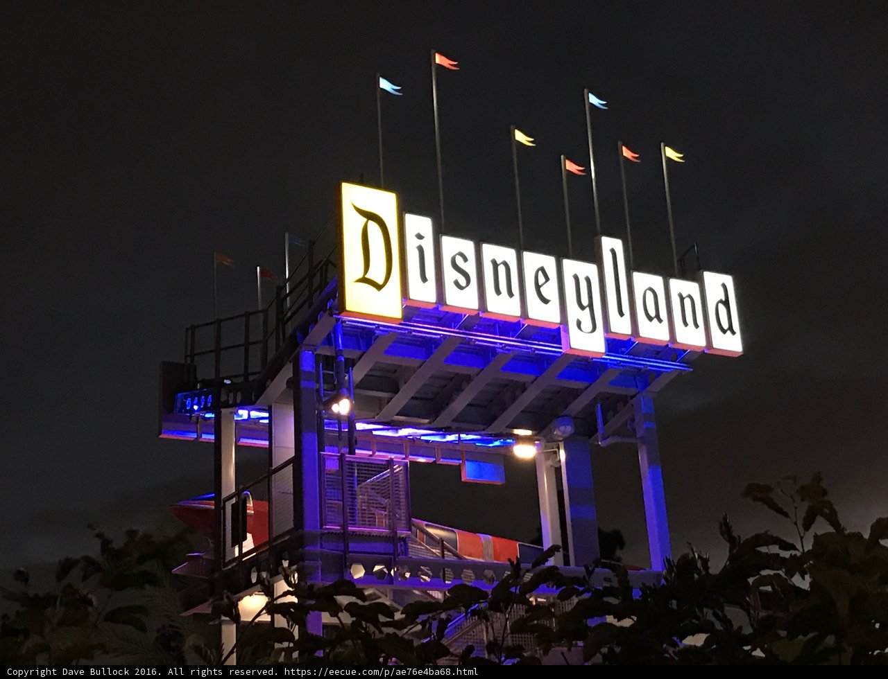 Twinkling Disneyland Hotel Sign at Night