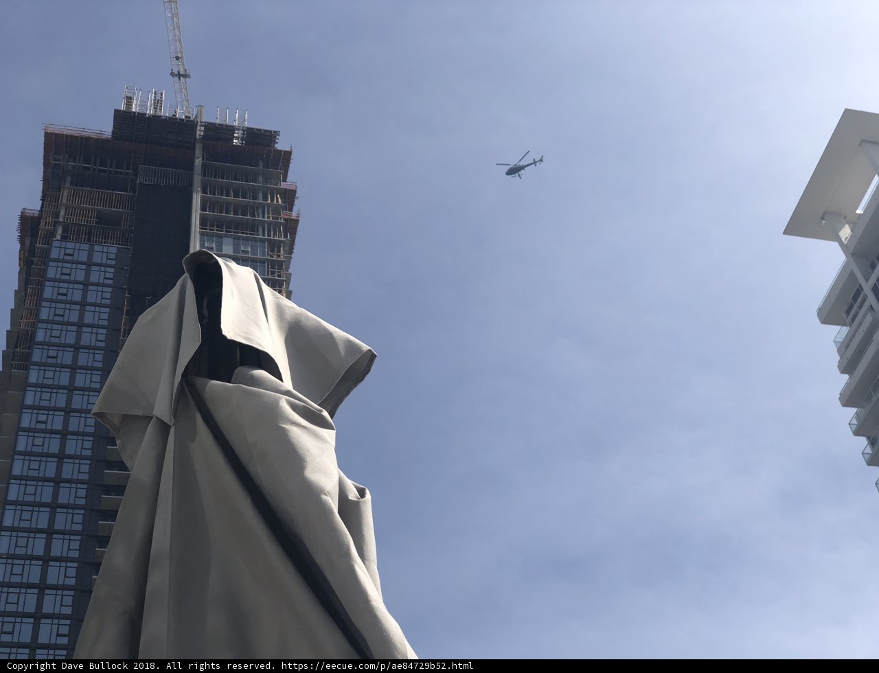 High-Flying Helicopter above the Cityscape