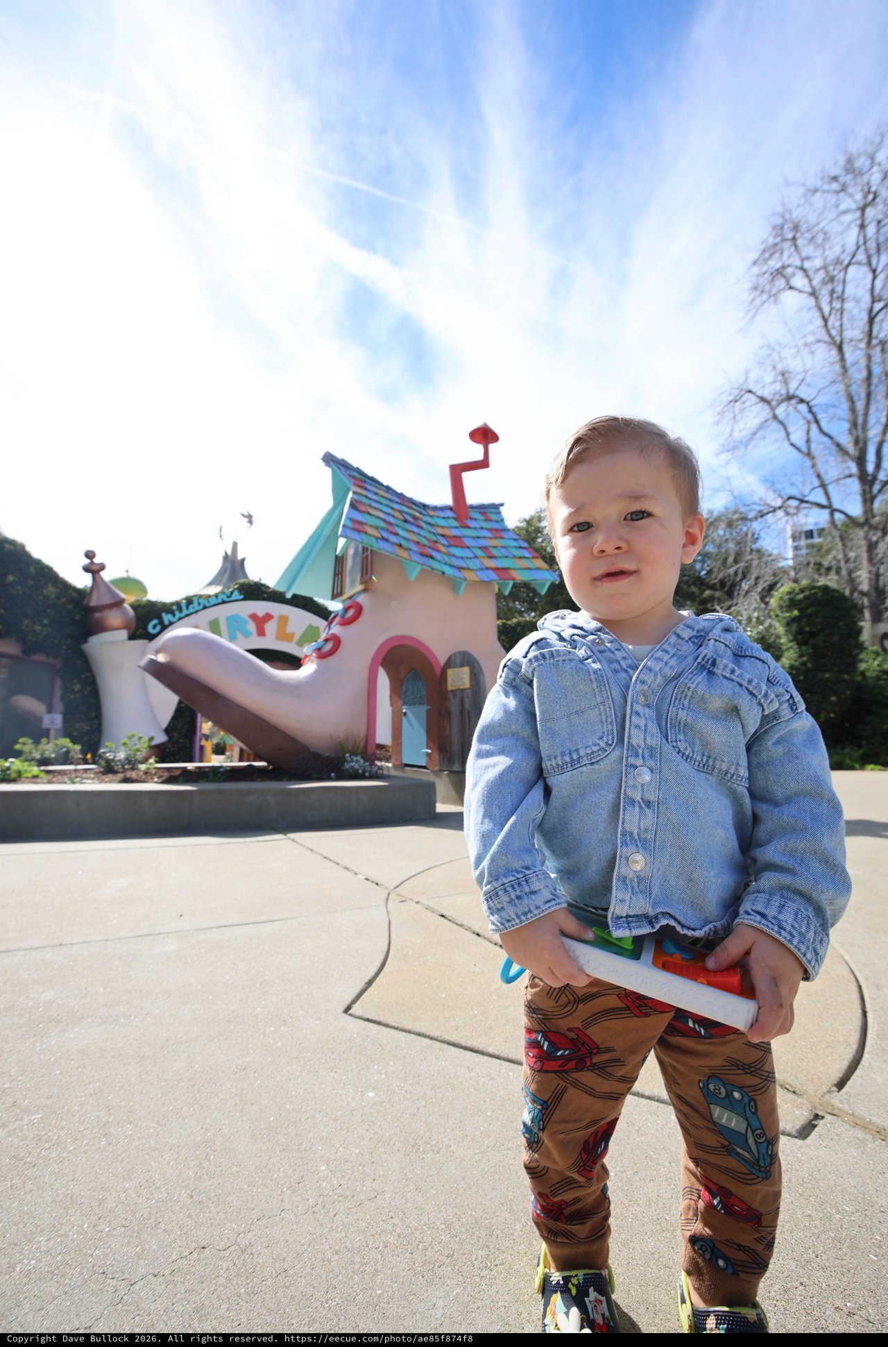 Toddler at Toontown Amusement Park on Sunny Day